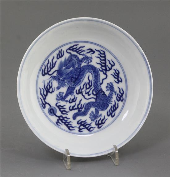 A Chinese blue and white dragon dish, diameter 16.3cm, some damage